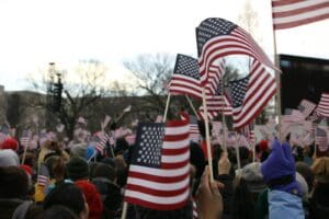 people holding us a flag during daytime