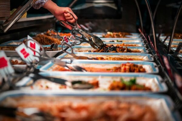 person holding stainless steel fork