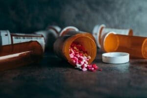 a close up of a bottle of pills on a table