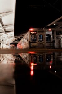 a train parked in a train station next to another train