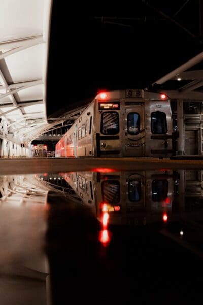 a train parked in a train station next to another train
